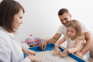 child playing with sand